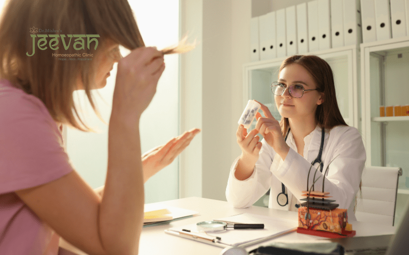 Woman discussing hair loss with doctor at desk.